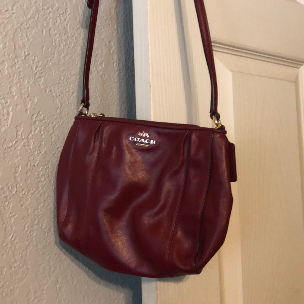Red Coach crossbody 22 inch, waist length.